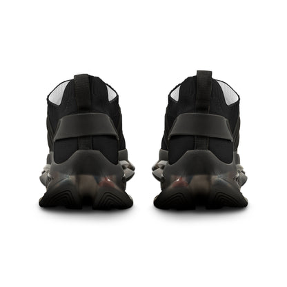 Black high-top sneakers with velcro straps on a white background