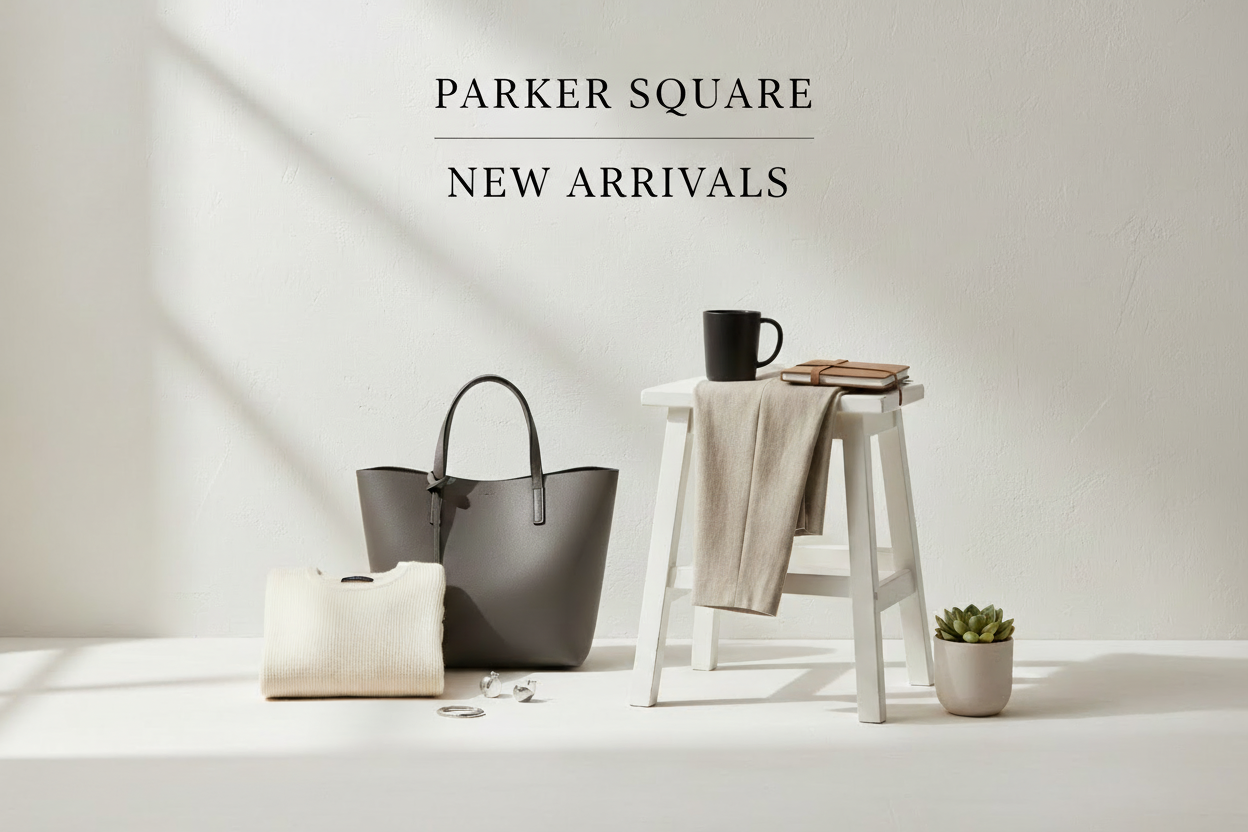 Gray handbag and white pouch on a white surface with 'Parker Square New Arrivals' text.